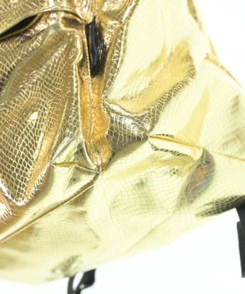 COMME des GARCONS（コムデギャルソン）バックパック・リュック ゴールド サイズ:- レディース/2200670247417