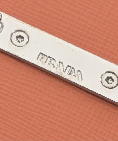 PRADA（プラダ）ブローチ・コサージュ オレンジ サイズ:- レディース/2200704840058